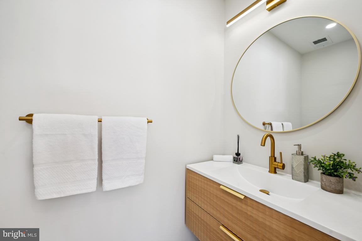 2 Sylvan Lane Willingboro, NJ 08046 - Photo 17 of 26 a bathroom with a sink and mirror