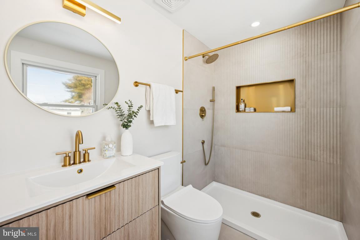 2 Sylvan Lane Willingboro, NJ 08046 - Photo 20 of 26 a bathroom with a sink a toilet and shower