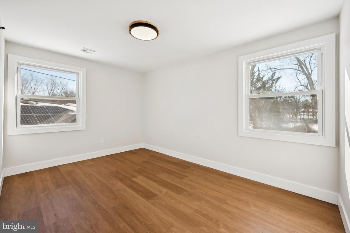 2 Sylvan Lane Willingboro, NJ 08046 - Photo 21 of 26 a view of an empty room with wooden floor and window