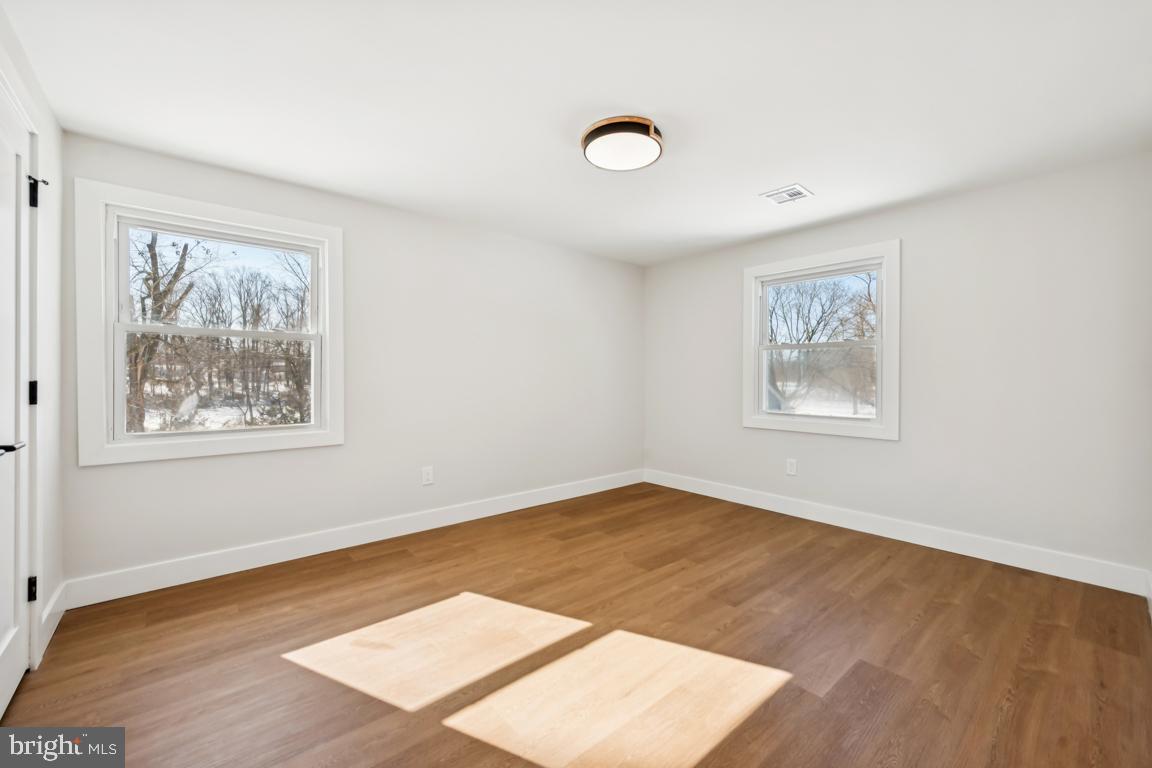 2 Sylvan Lane Willingboro, NJ 08046 - Photo 22 of 26 a view of an empty room with wooden floor and a window