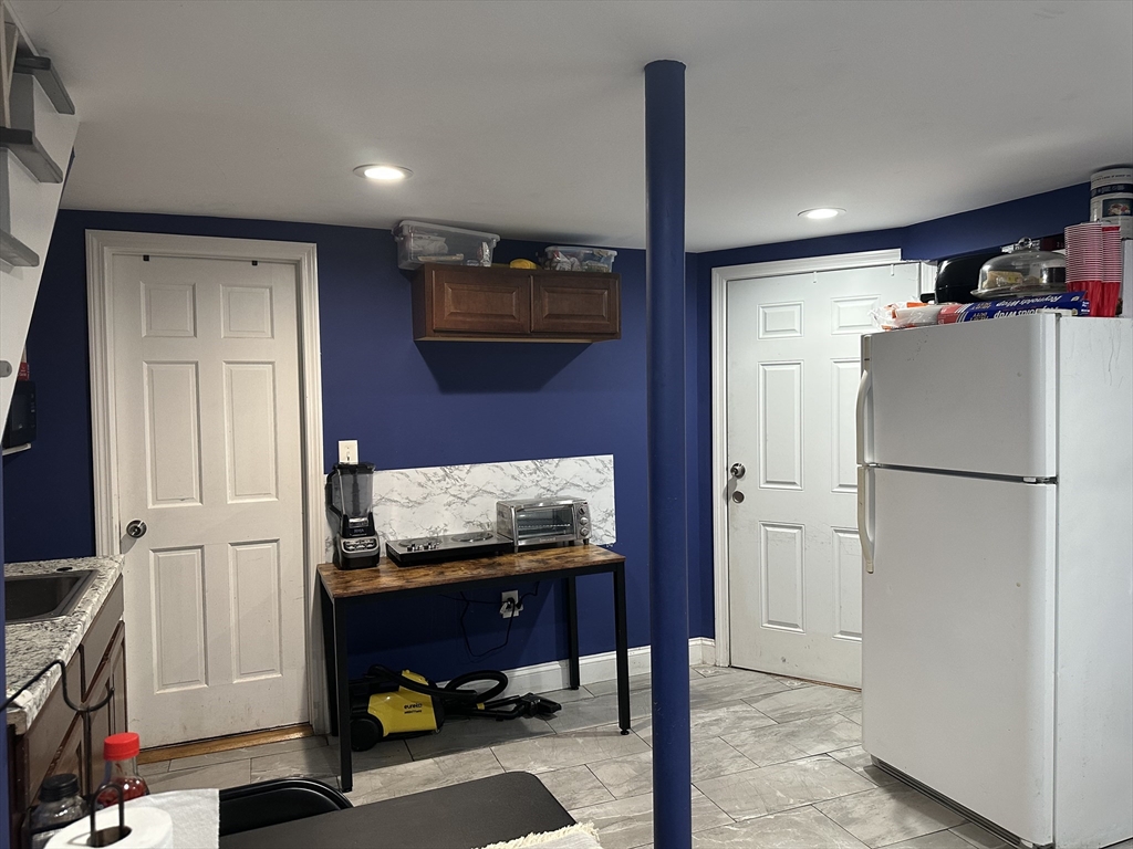 115 Addison Street Chelsea, MA 02150 - Photo 7 of 16 a room with storage and utility