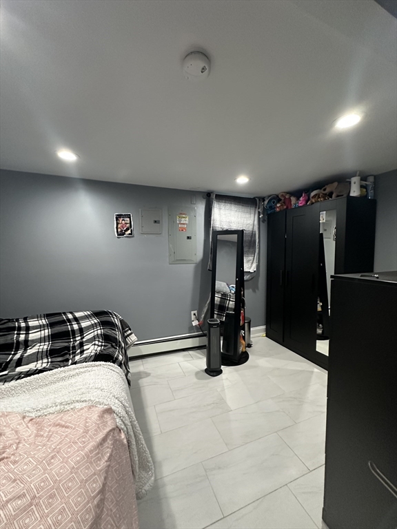 115 Addison Street Chelsea, MA 02150 - Photo 10 of 16 a room with gym equipment and a large window