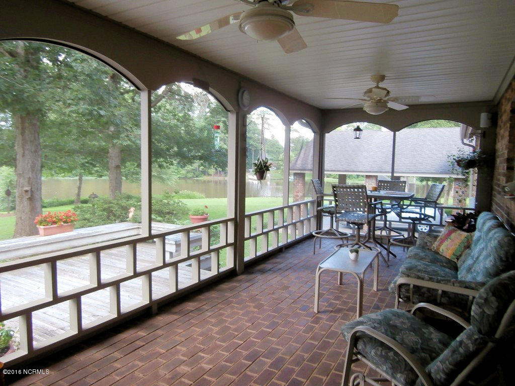 6907 Riverpoint Road Elm City, NC 27822 - Photo 20 of 44 Screen Porch view 1 - One of several areas that are ideal for Family, Friends, Co-workers, etc. to Relax, Have Fun & Be Entertained.