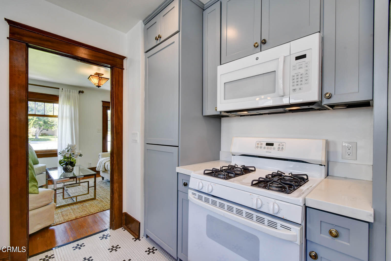 149 Grand Avenue Monrovia, CA 91016 - Photo 12 of 50 a kitchen with stainless steel appliances white cabinets and stove