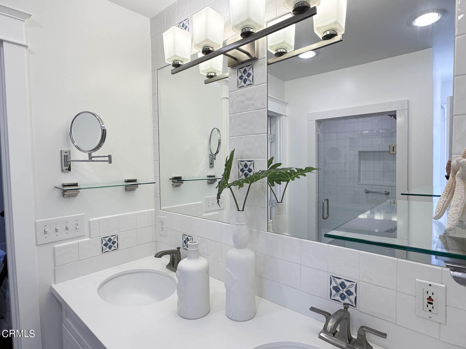 149 Grand Avenue Monrovia, CA 91016 - Photo 18 of 50 a bathroom with a sink a mirror and a shower