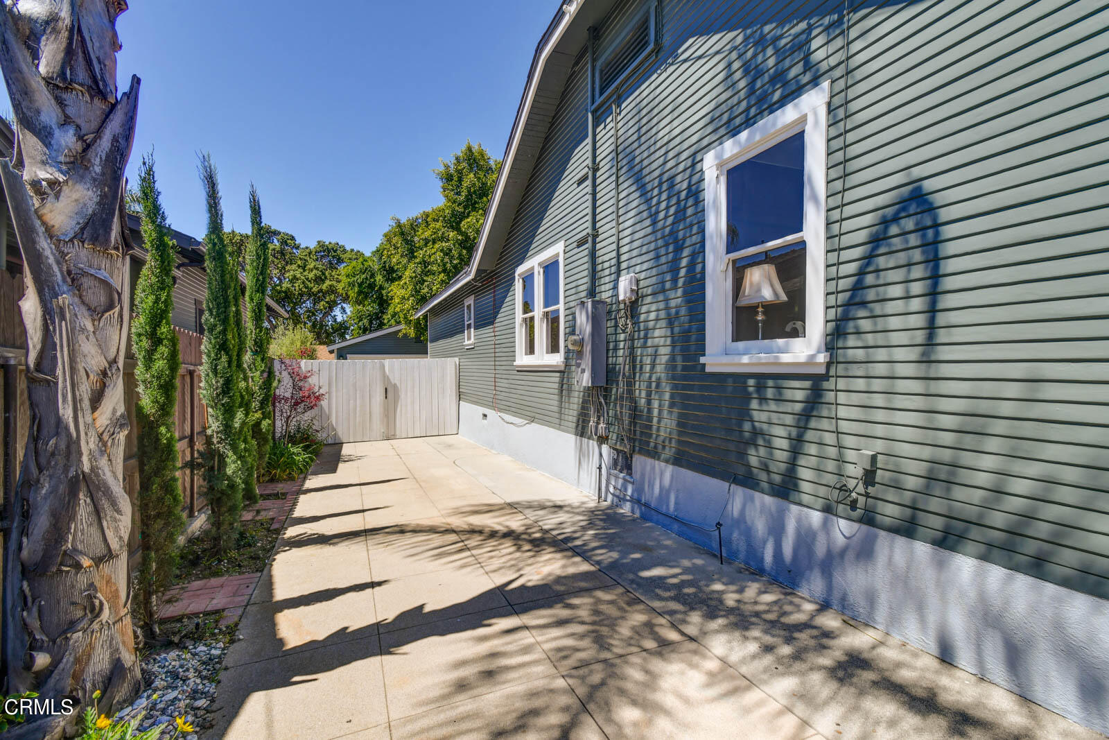 149 Grand Avenue Monrovia, CA 91016 - Photo 46 of 50 a yellow house with trees in front of it