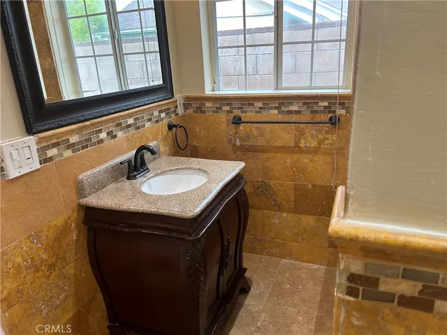 a view of a room with wooden floor and windows
