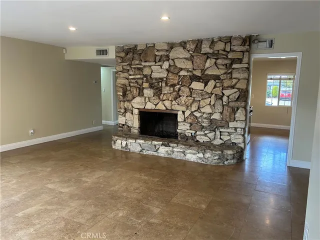 a view of a fireplace with wooden floor