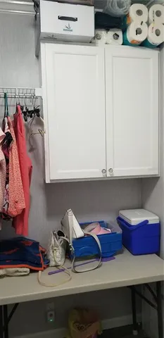 a view of storage and utility room with two washing machine