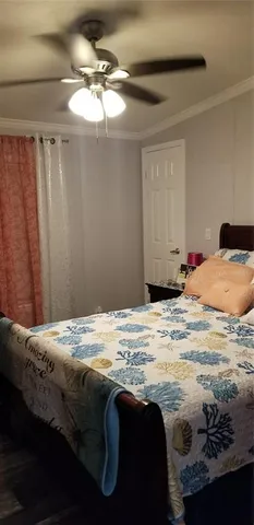 a bedroom with a bed and curtain