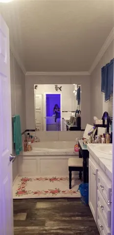 a kitchen with sink cabinets and stove top oven