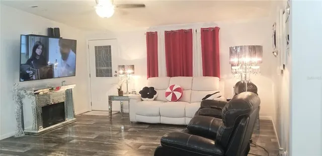 a living room with furniture and a fireplace