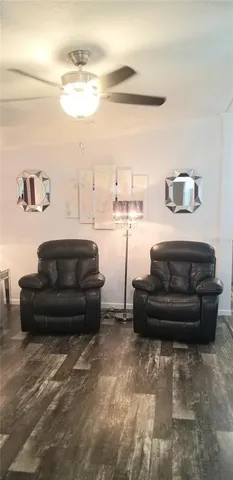 a living room with furniture and a painting