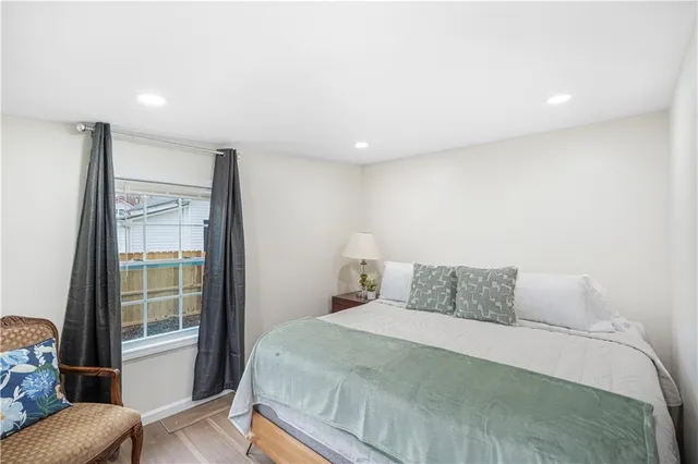 a bedroom with a large bed and a couch