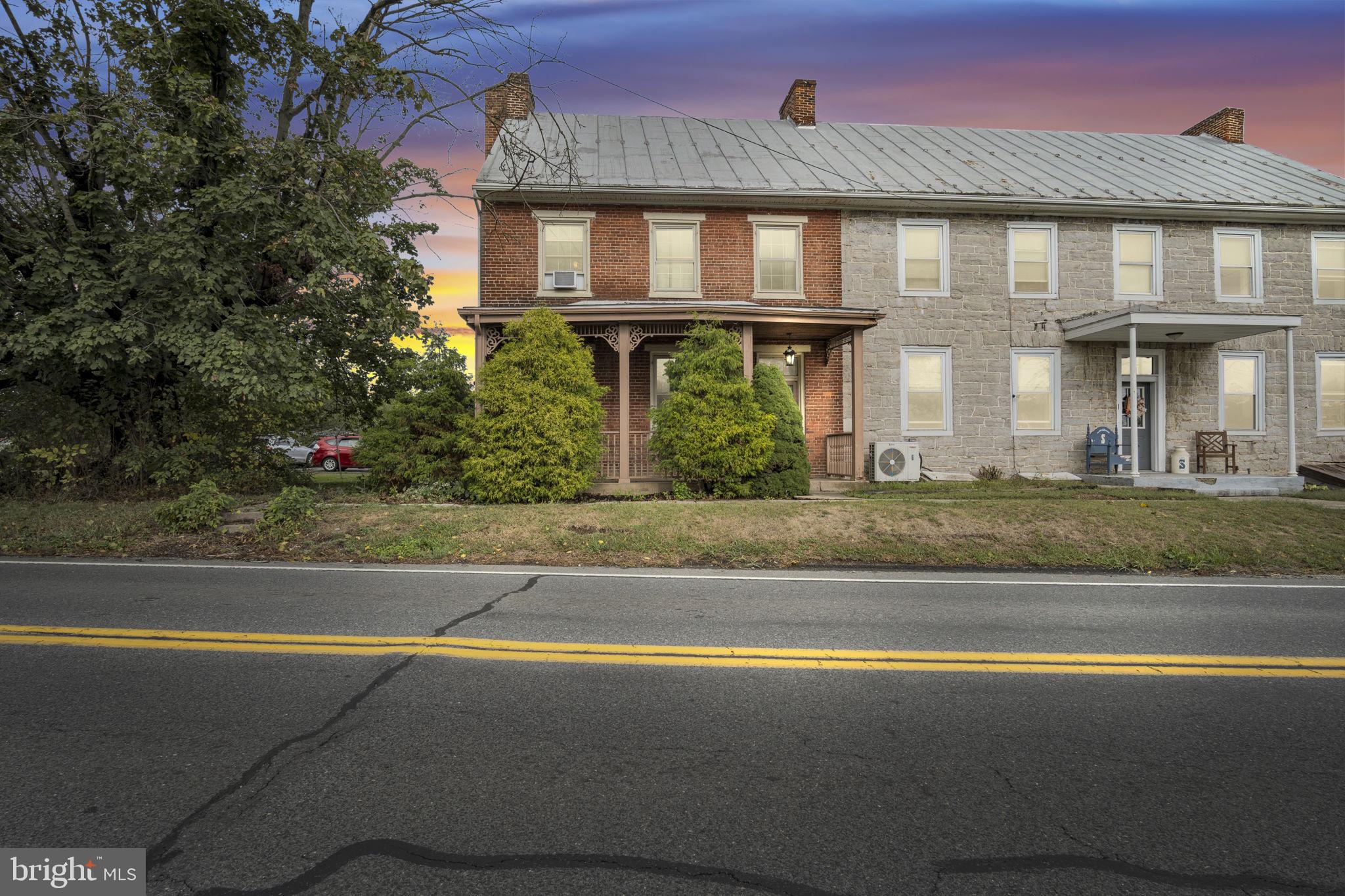 2143 Newville Road Carlisle, PA 17015 - Photo 1 of 40 a front view of a house with a yard