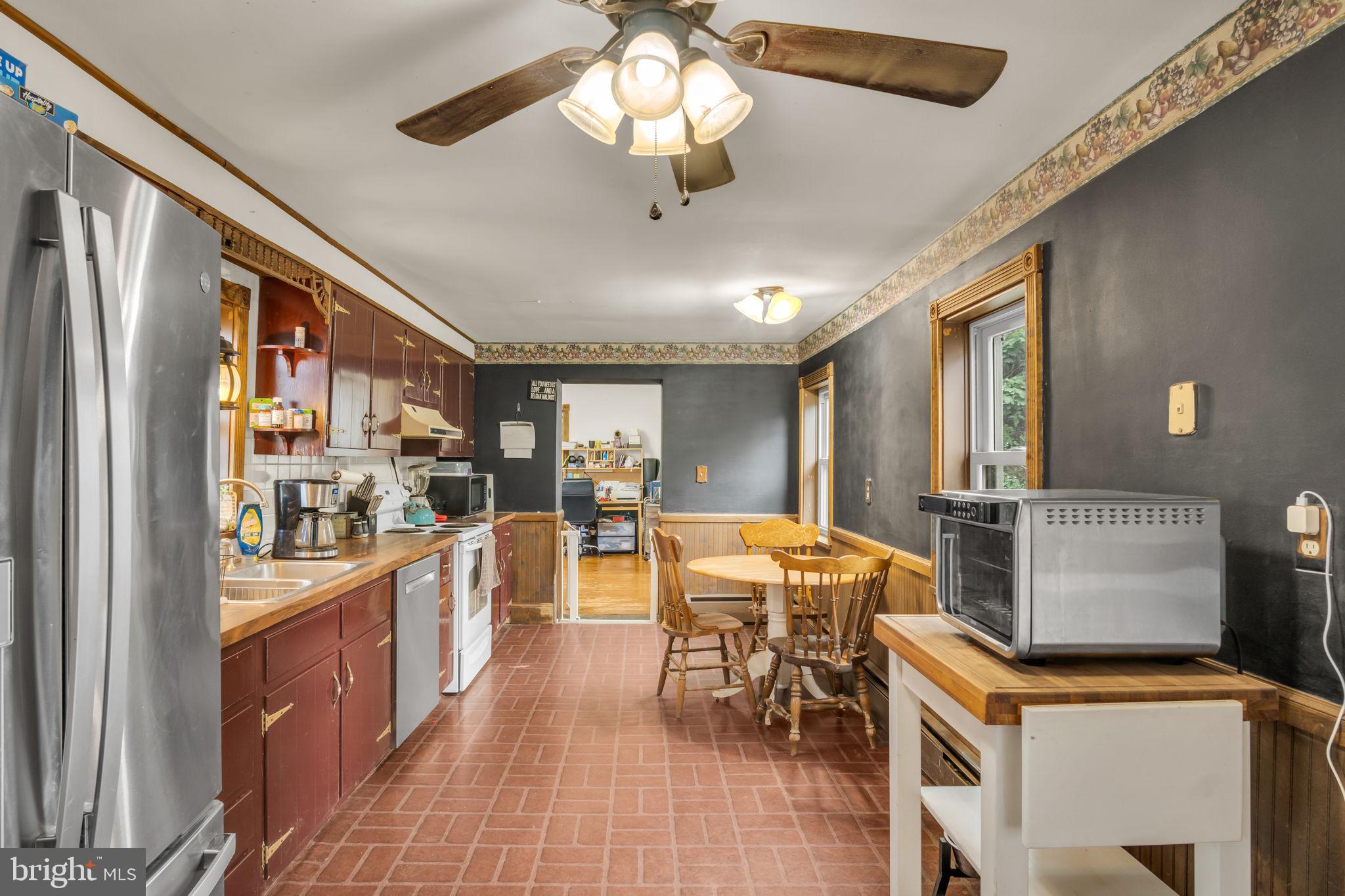 2143 Newville Road Carlisle, PA 17015 - Photo 13 of 40 a view of a dining room with furniture window and wooden floor