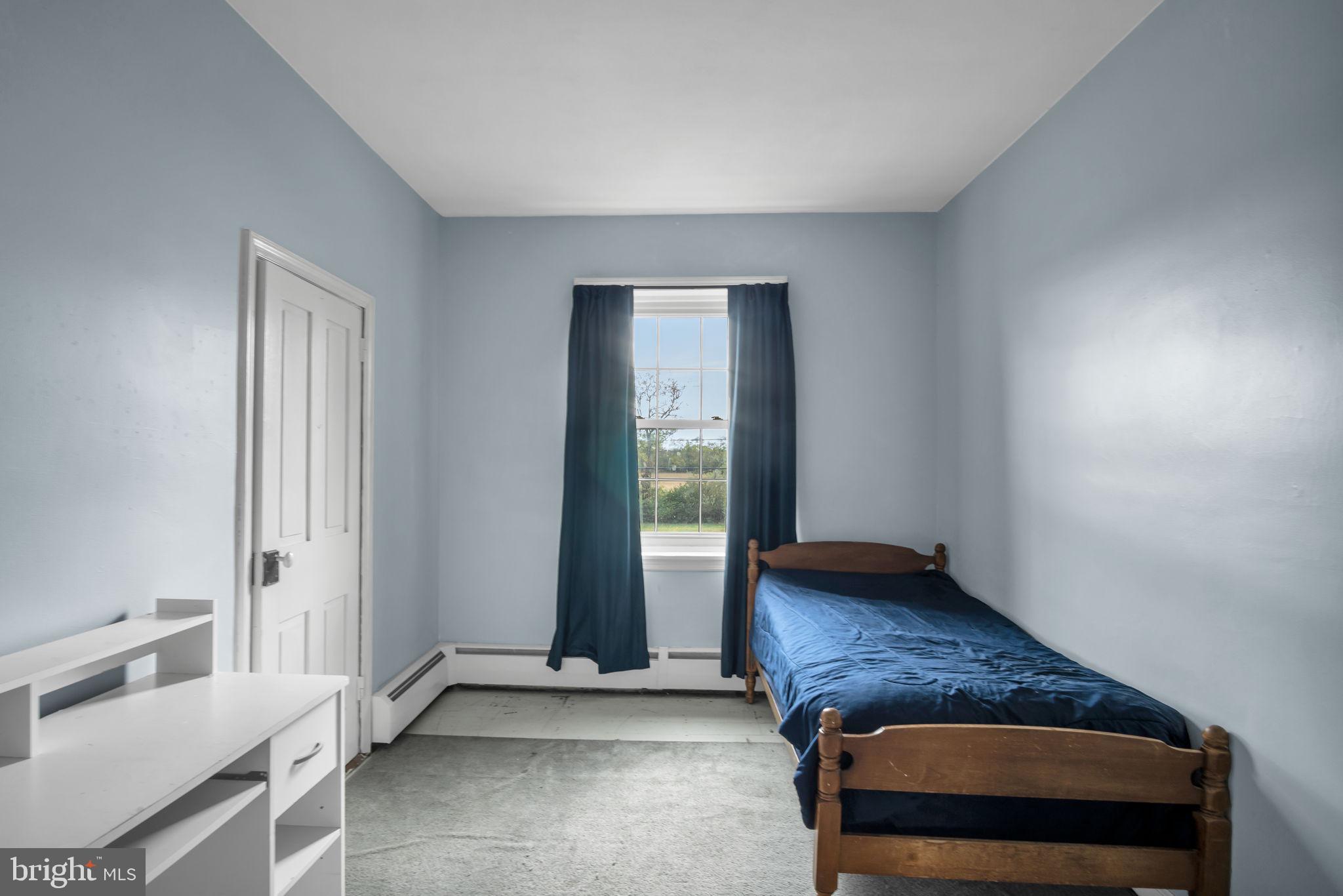 2143 Newville Road Carlisle, PA 17015 - Photo 17 of 40 a living room with a dresser and a window