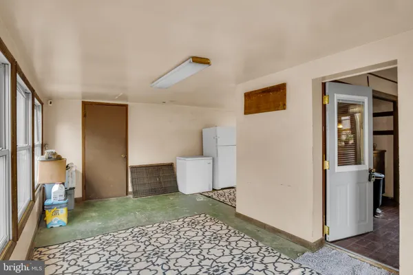 a view of a room with large windows