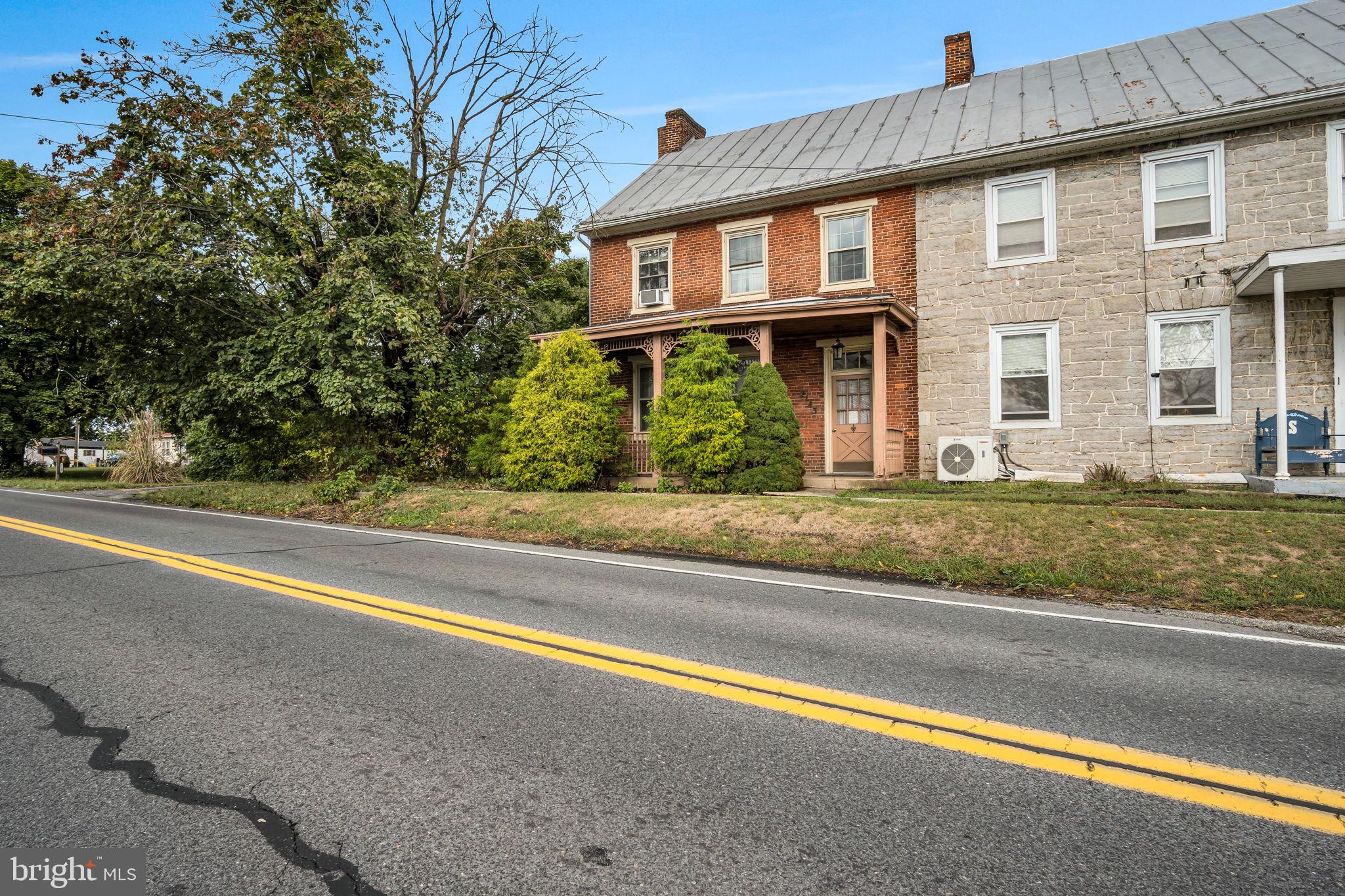2143 Newville Road Carlisle, PA 17015 - Photo 3 of 40 a front view of a house with a yard