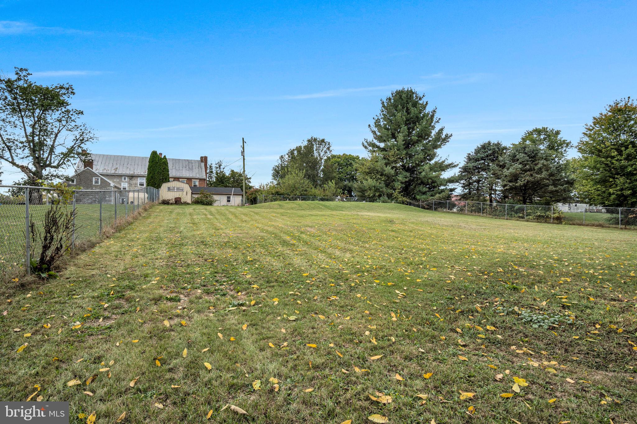 2143 Newville Road Carlisle, PA 17015 - Photo 34 of 40 a view of a field with an trees in the background