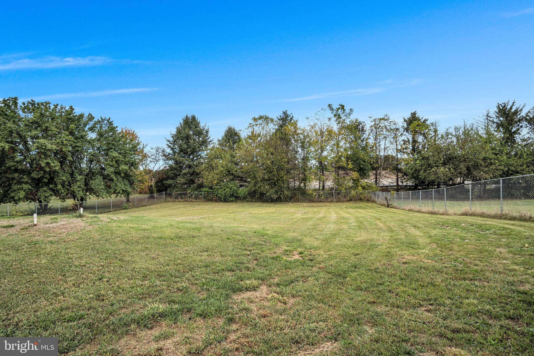 2143 Newville Road Carlisle, PA 17015 - Photo 35 of 40 a view of a field with trees in the background
