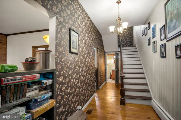 a view of entryway with wooden floor