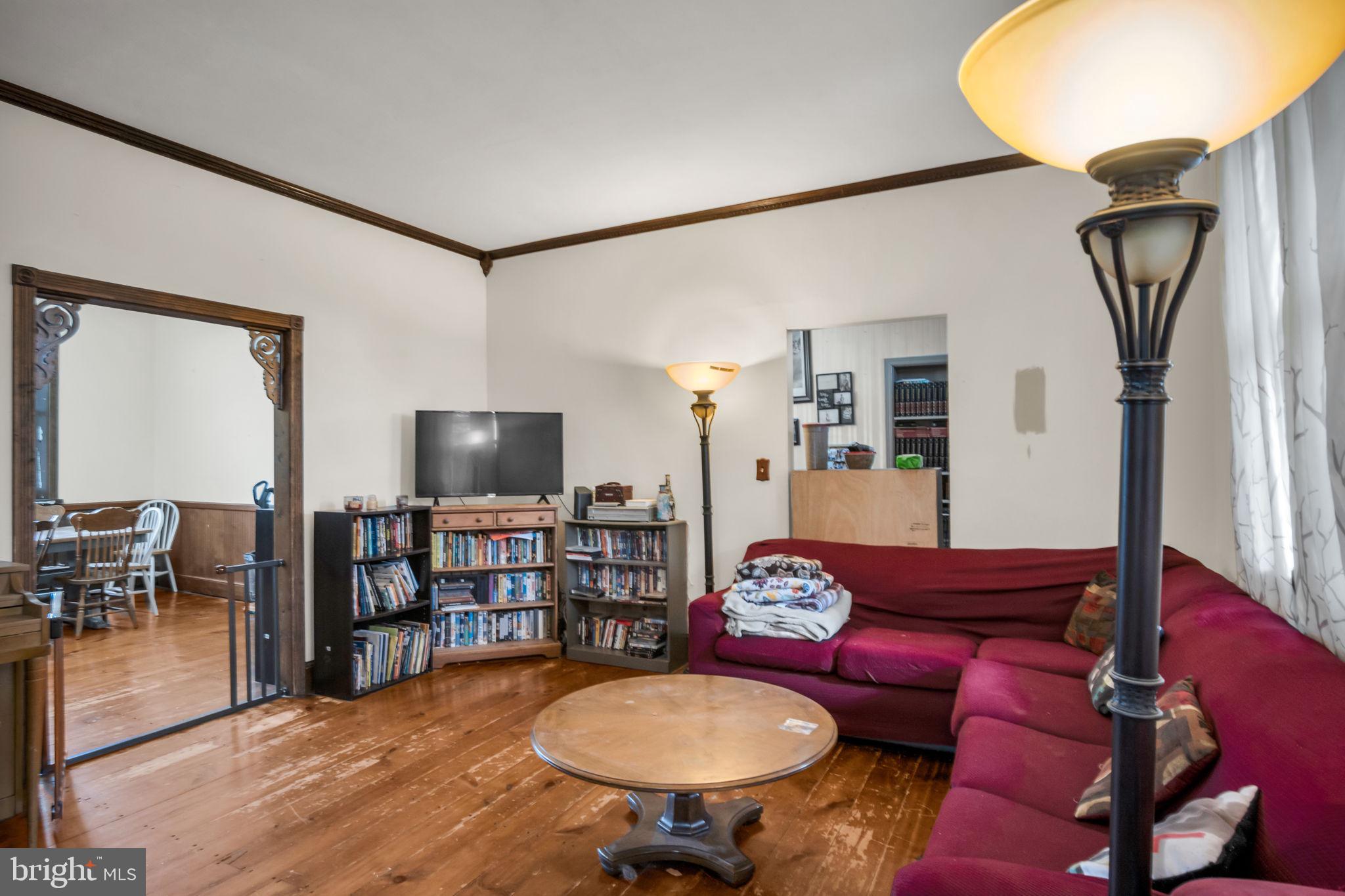 2143 Newville Road Carlisle, PA 17015 - Photo 8 of 40 a living room with furniture a rug and a flat screen tv