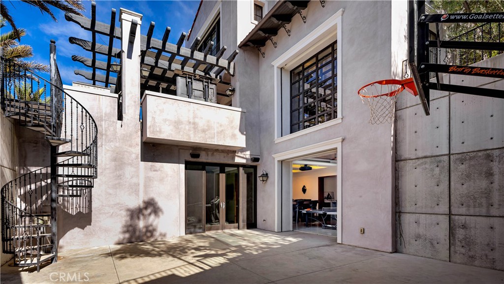 2 Thomas Road Ladera Ranch, CA 92694 - Photo 18 of 69 How about a competitive basketball game on your own half court? Enter the space from the game room with its unique garage door entry, your own gym or from the pool area upstairs.