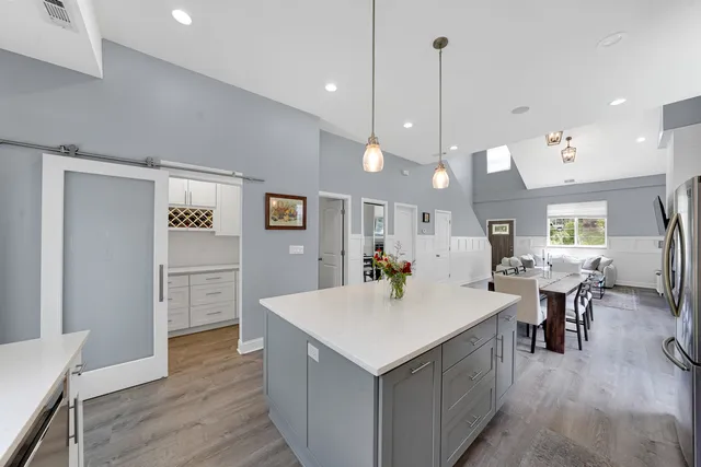 a view of kitchen with cabinets and wooden floor