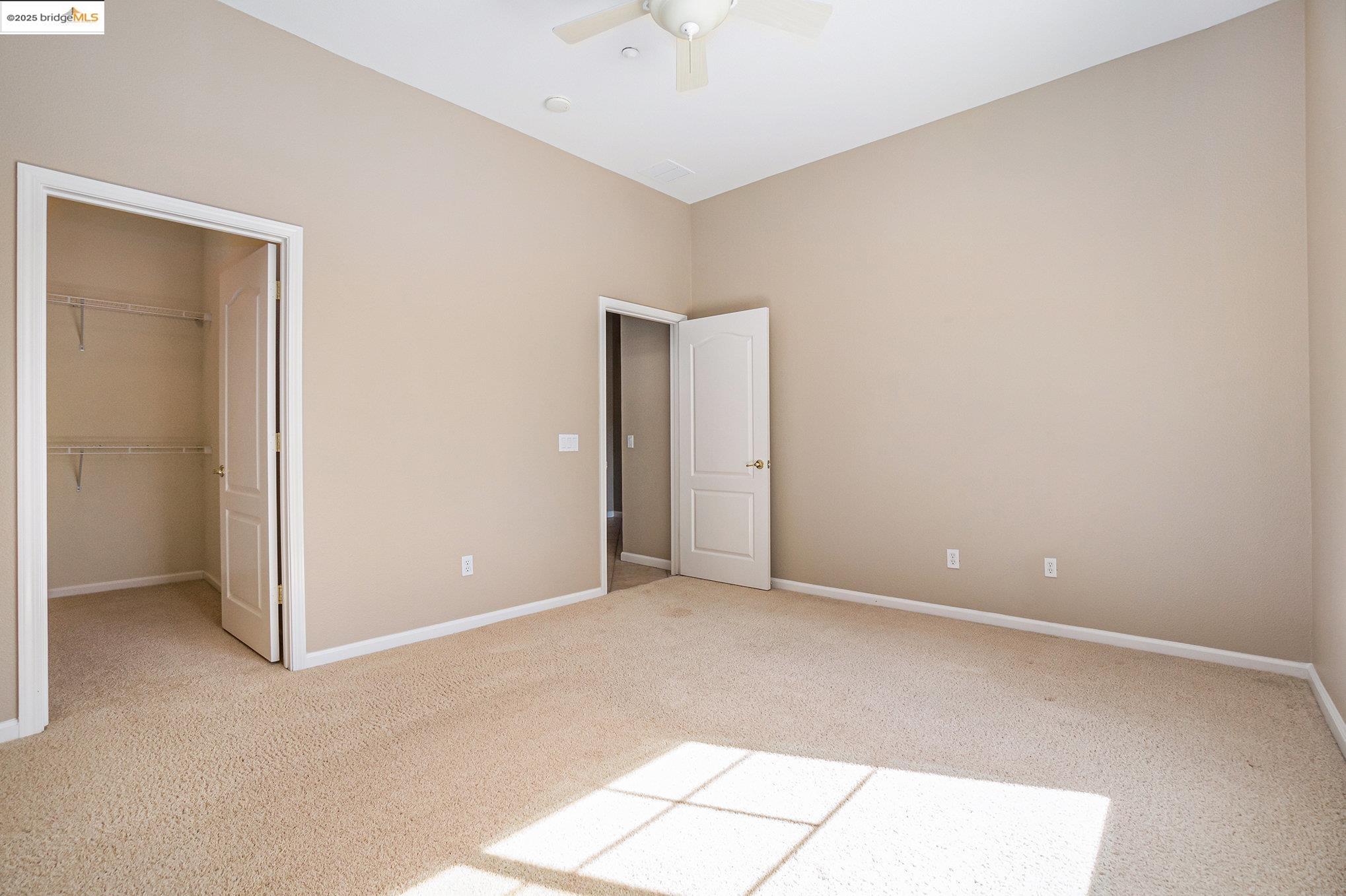 599 Pomona Drive Brentwood, CA 94513 - Photo 15 of 35 Unfurnished bedroom with carpet floors, a spacious closet, and ceiling fan