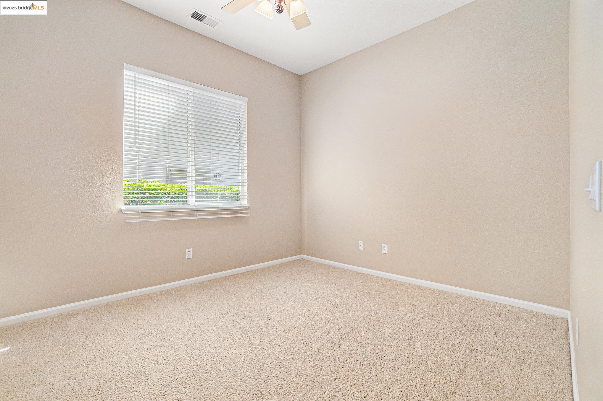 599 Pomona Drive Brentwood, CA 94513 - Photo 16 of 35 Carpeted spare room with baseboards and ceiling fan