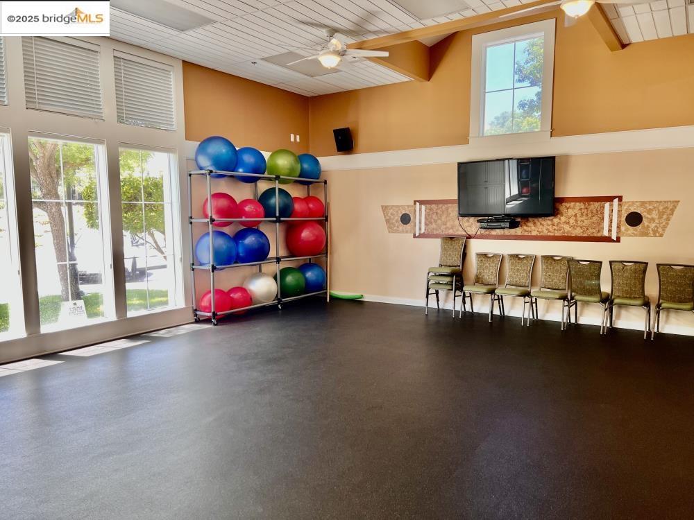 599 Pomona Drive Brentwood, CA 94513 - Photo 30 of 35 Workout room featuring plenty of natural light, a ceiling fan, a high ceiling, and wood ceiling