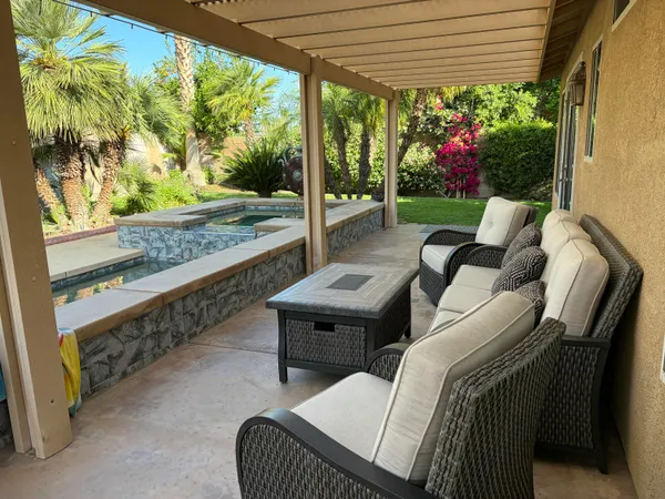 a outdoor living space with furniture and garden view