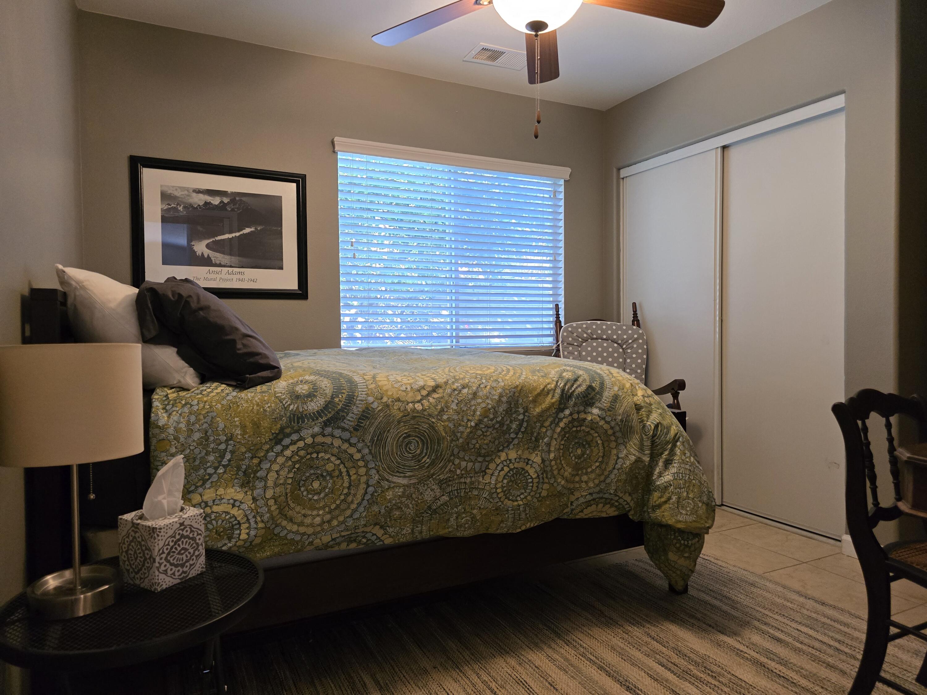47719 Avocado Court Indio, CA 92201 - Photo 14 of 22 a bedroom with a bed and wooden floor