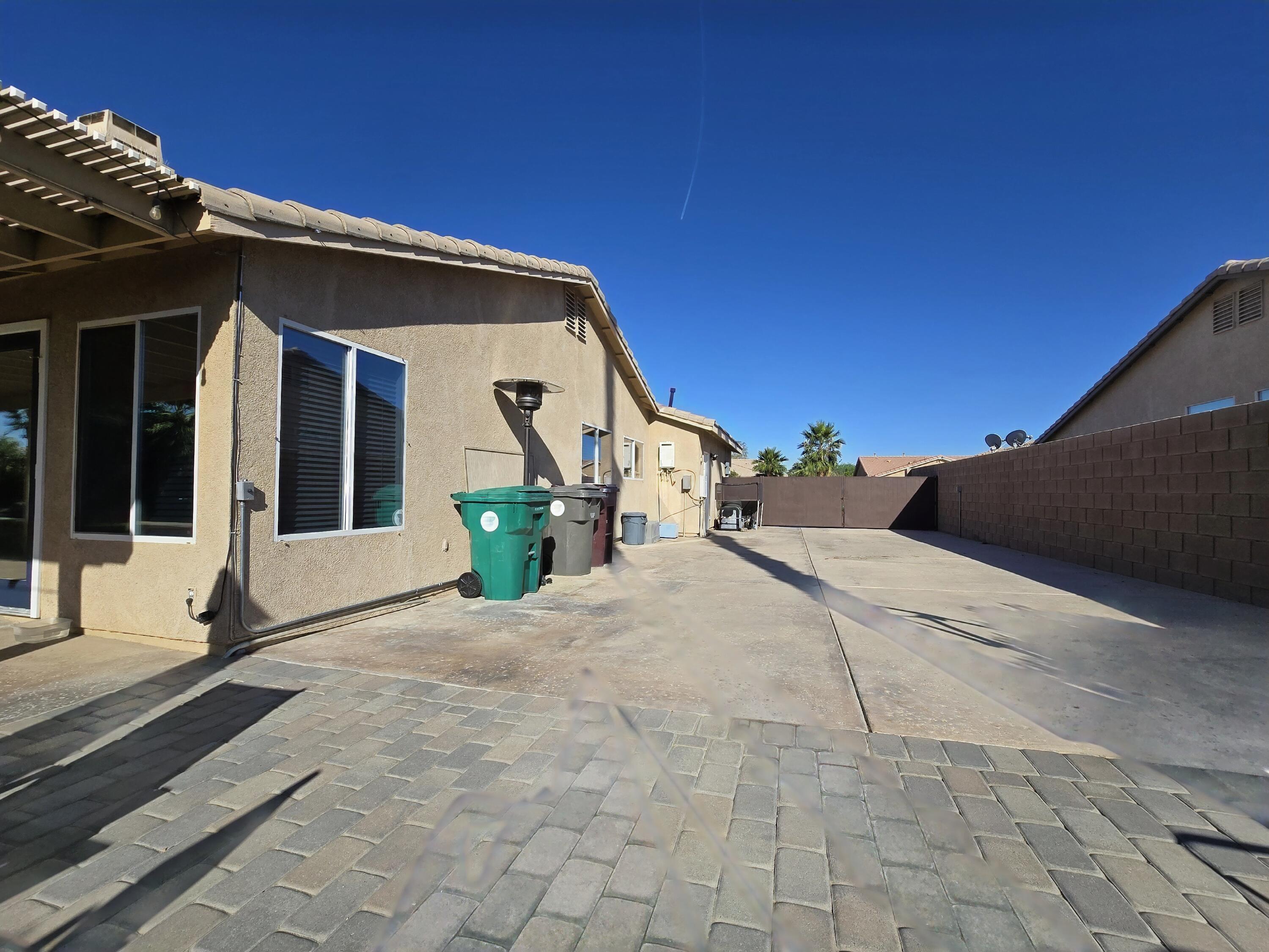 47719 Avocado Court Indio, CA 92201 - Photo 20 of 22 a view of a house with a backyard