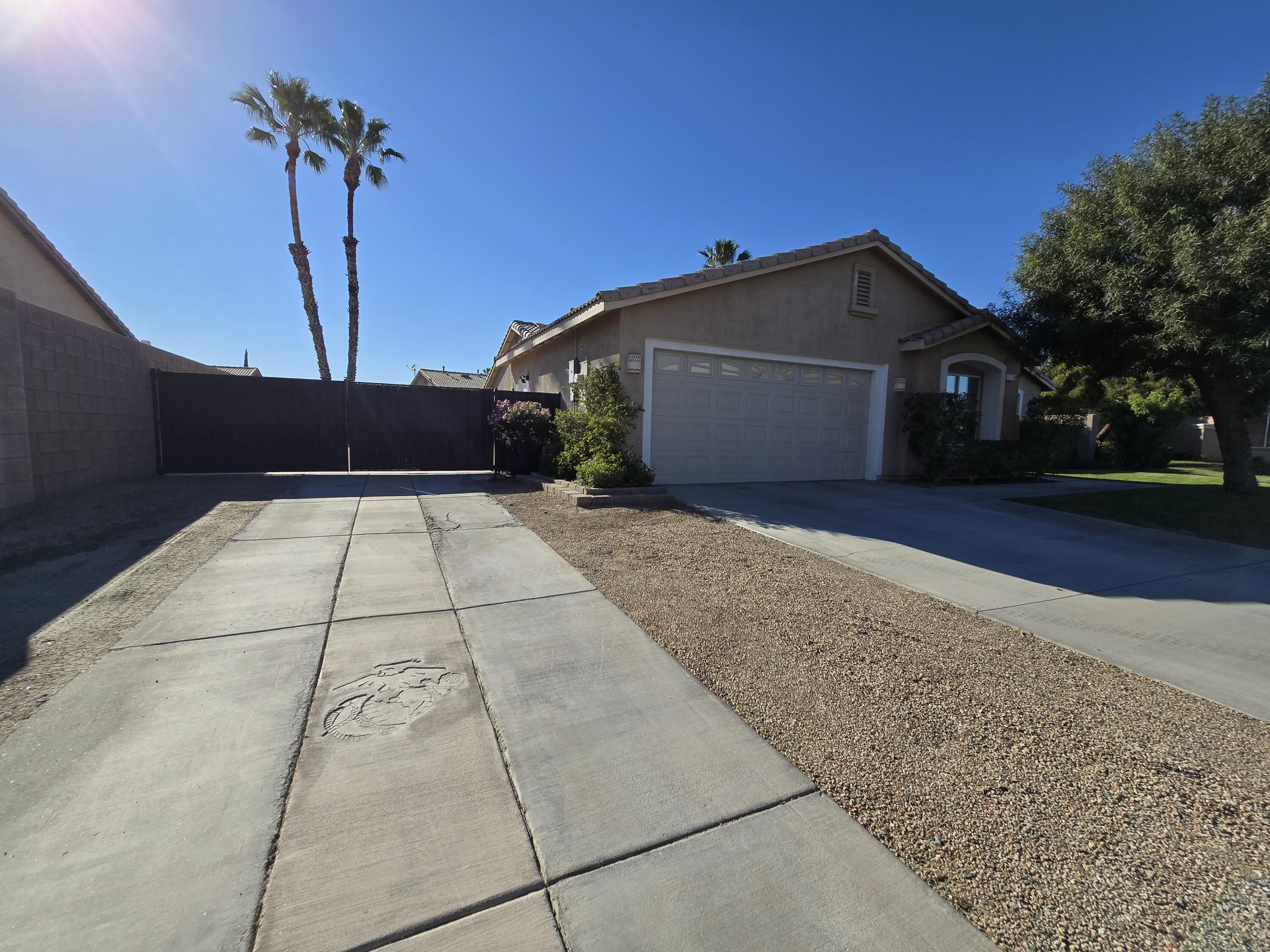 47719 Avocado Court Indio, CA 92201 - Photo 22 of 22 a front view of a house with a yard