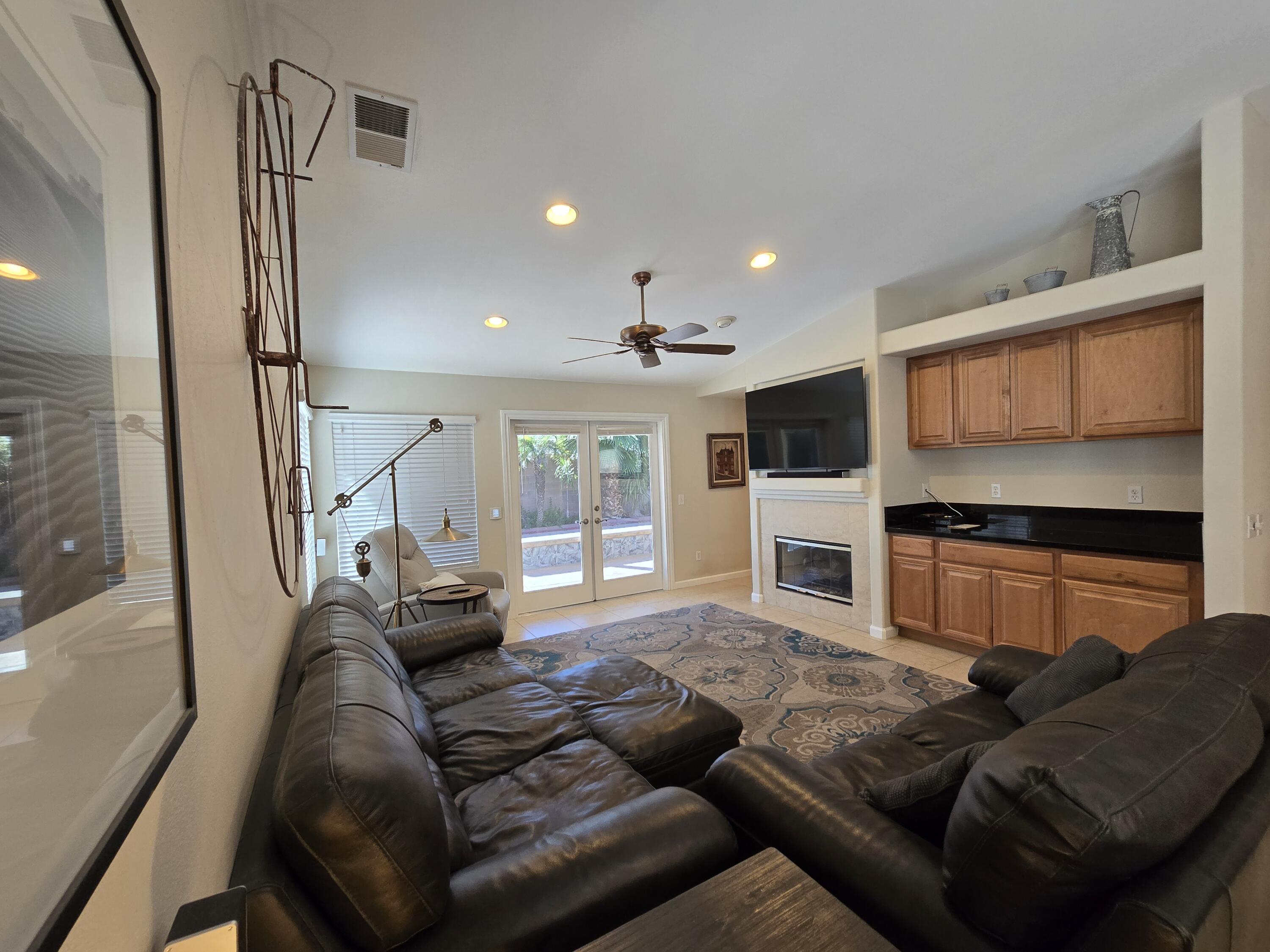 47719 Avocado Court Indio, CA 92201 - Photo 6 of 22 a living room with furniture and a flat screen tv