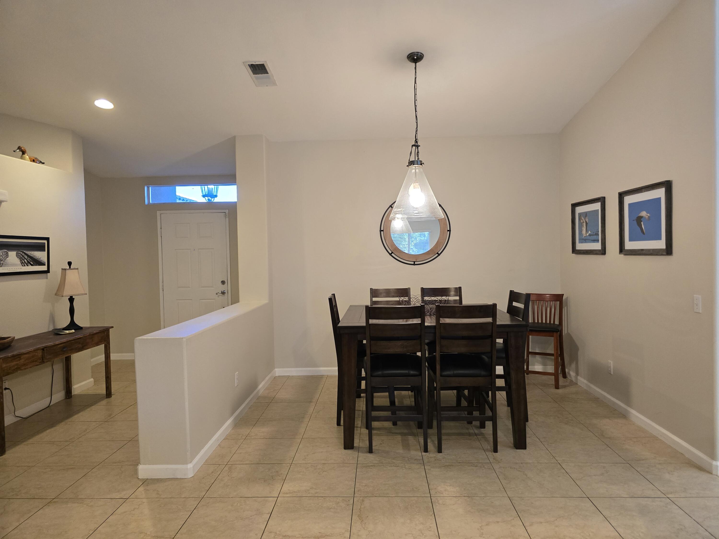 47719 Avocado Court Indio, CA 92201 - Photo 8 of 22 a view of a dining room and livingroom