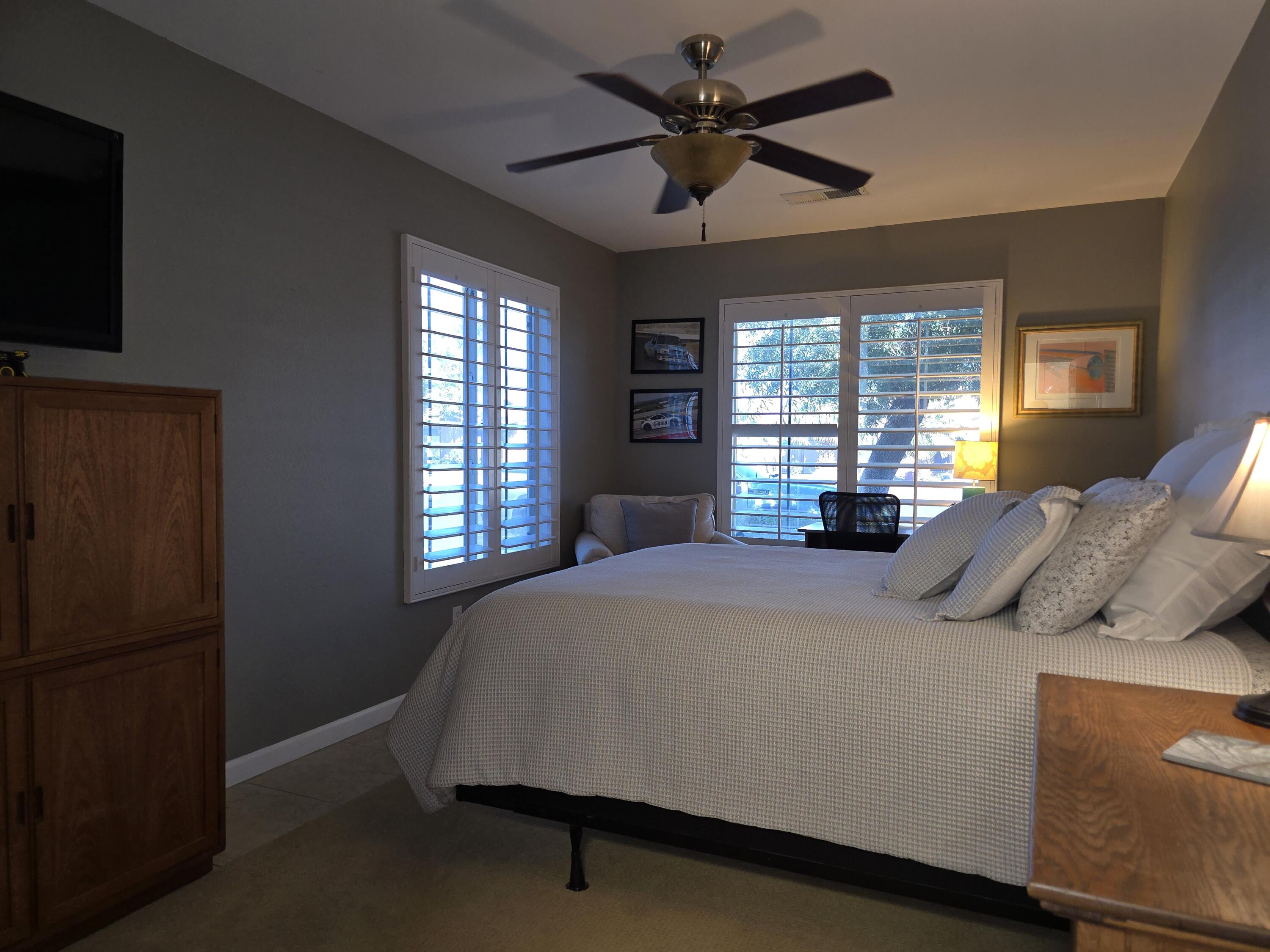 47719 Avocado Court Indio, CA 92201 - Photo 10 of 22 a bed sitting in a bedroom next to a window