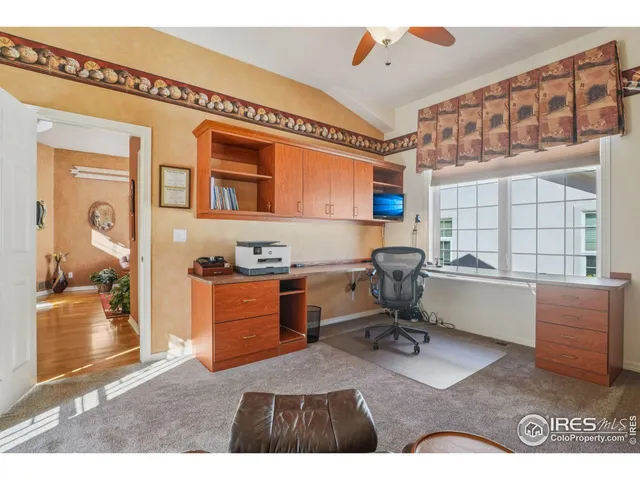 a workspace with furniture and a window