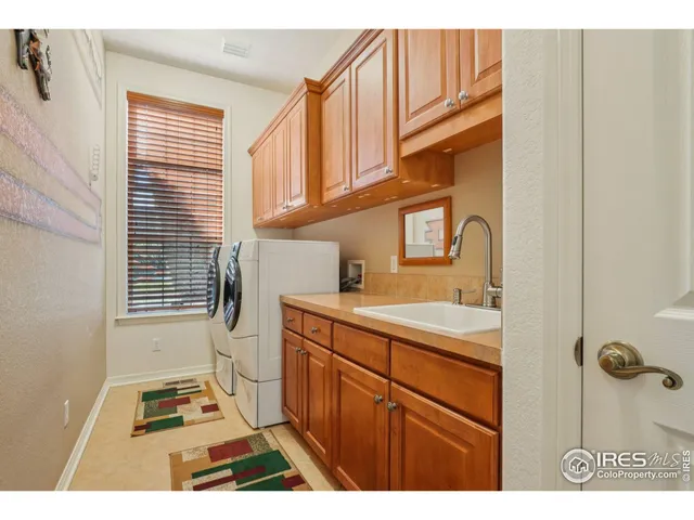 a kitchen that has a sink and a stove