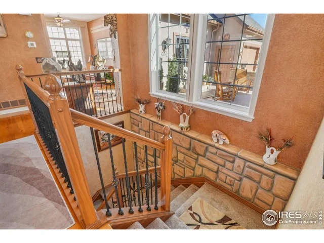 a view of a balcony with furniture