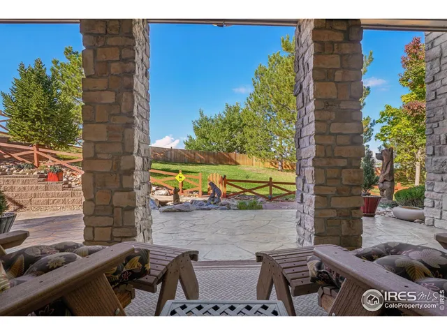 a view of balcony with two chairs and a table