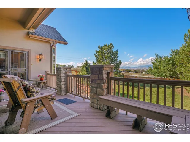 a view of a chairs and table in the balcony