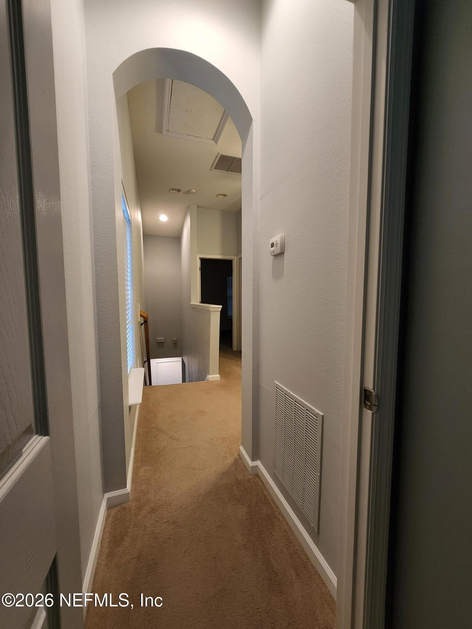 13030 Shallowater Road Jacksonville, FL 32258 - Photo 15 of 27 a view of a hallway with a livingroom and a bathroom