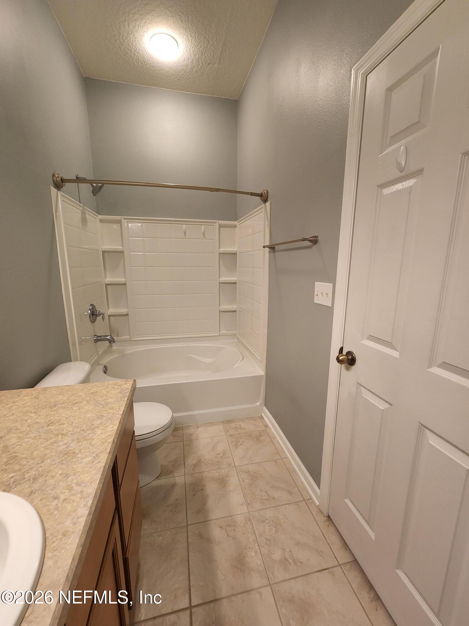 13030 Shallowater Road Jacksonville, FL 32258 - Photo 18 of 27 a bathroom with a sink and a mirror