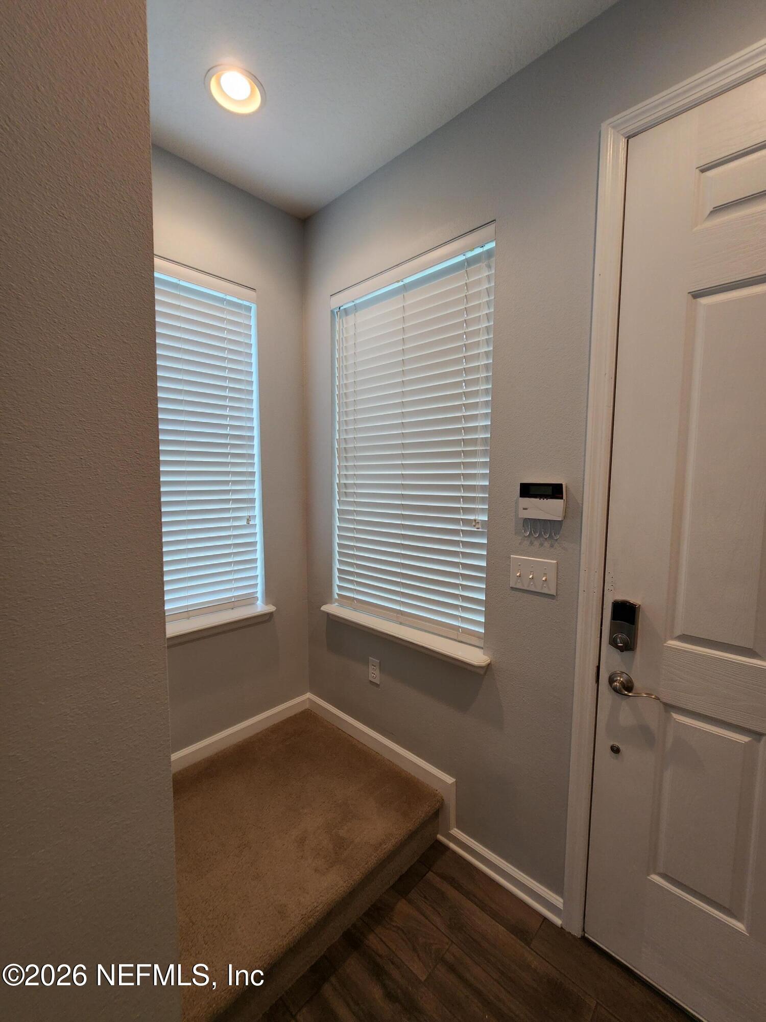 13030 Shallowater Road Jacksonville, FL 32258 - Photo 2 of 27 a view of a room with wooden floor and windows