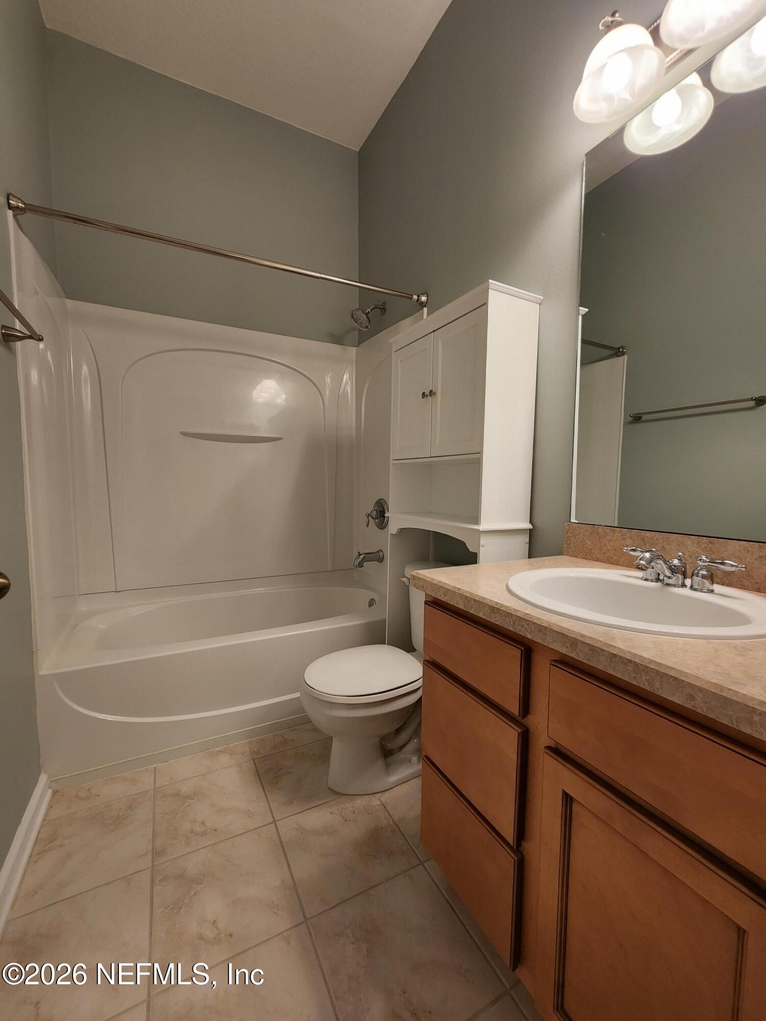13030 Shallowater Road Jacksonville, FL 32258 - Photo 21 of 27 a bathroom with a sink a toilet and shower