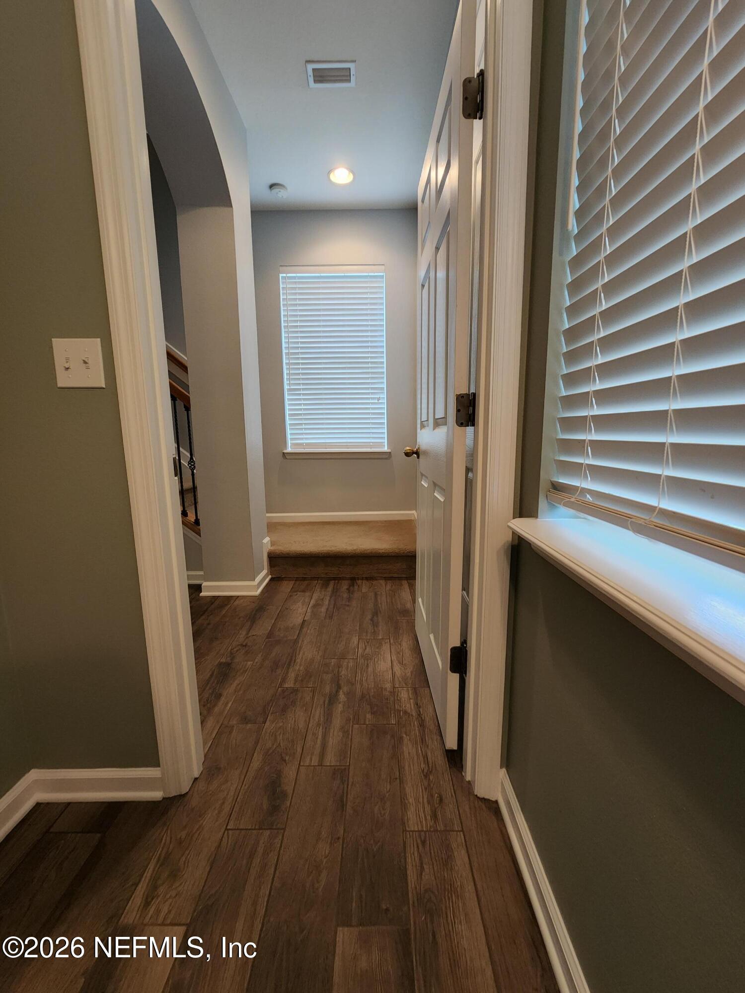 13030 Shallowater Road Jacksonville, FL 32258 - Photo 3 of 27 a view of a hallway with wooden floor and staircase