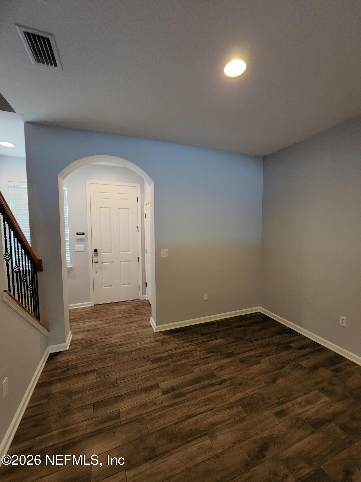 13030 Shallowater Road Jacksonville, FL 32258 - Photo 7 of 27 wooden floor in an empty room with a window